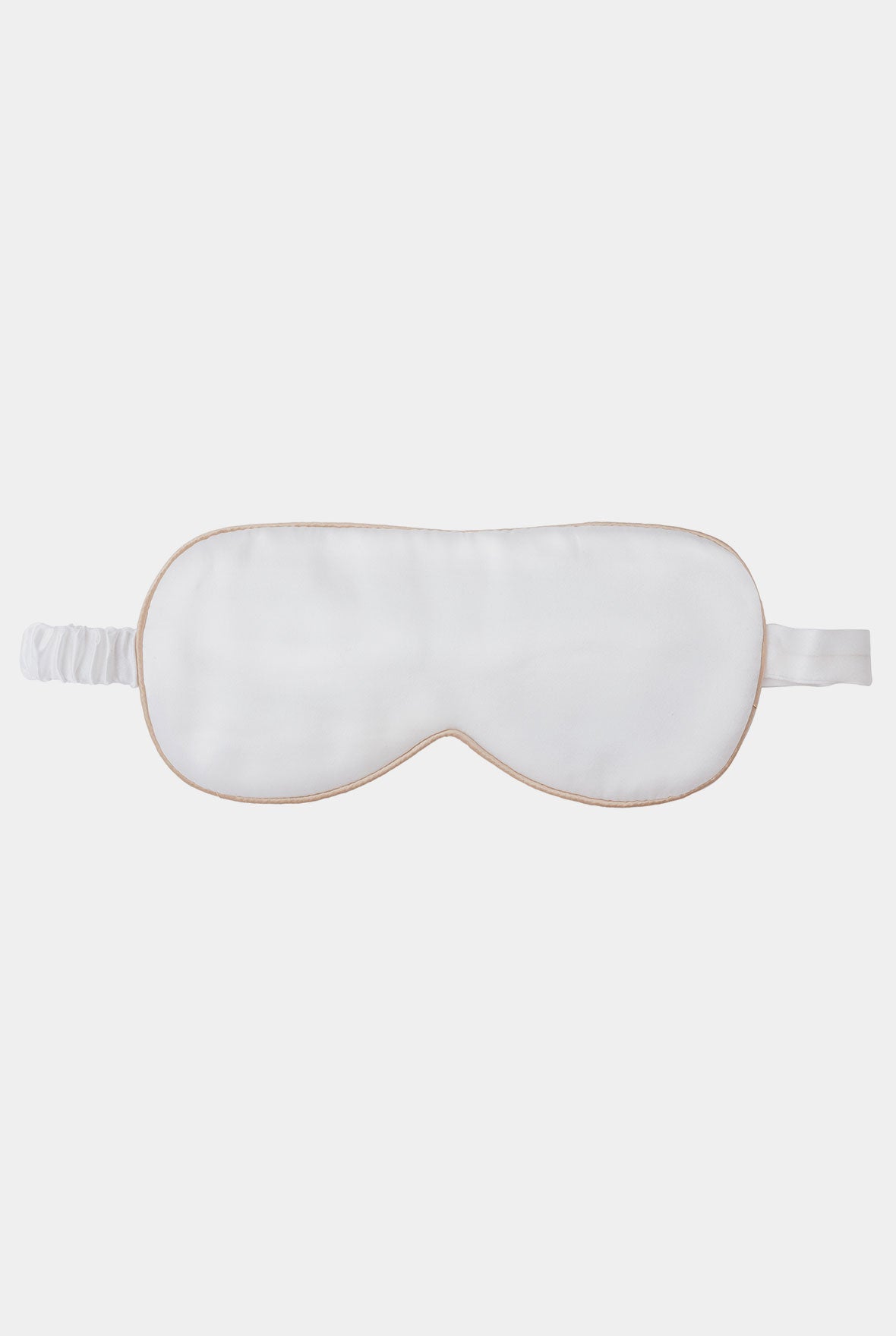 White silk sleep mask Nokaya with gold trim on a white background