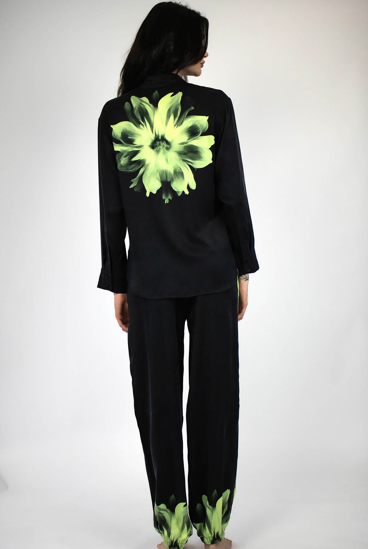 Black silk with green floral design from Nokaya on a plain background