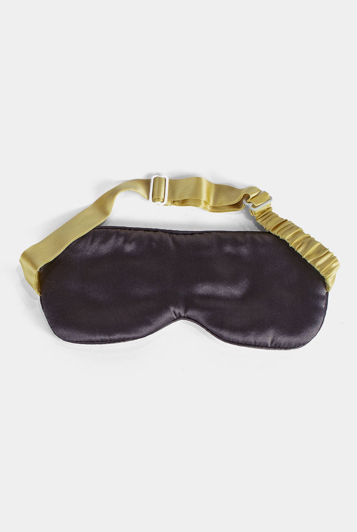 Slk eye mask's reverse side on a white background witj yllow trim Nokaya