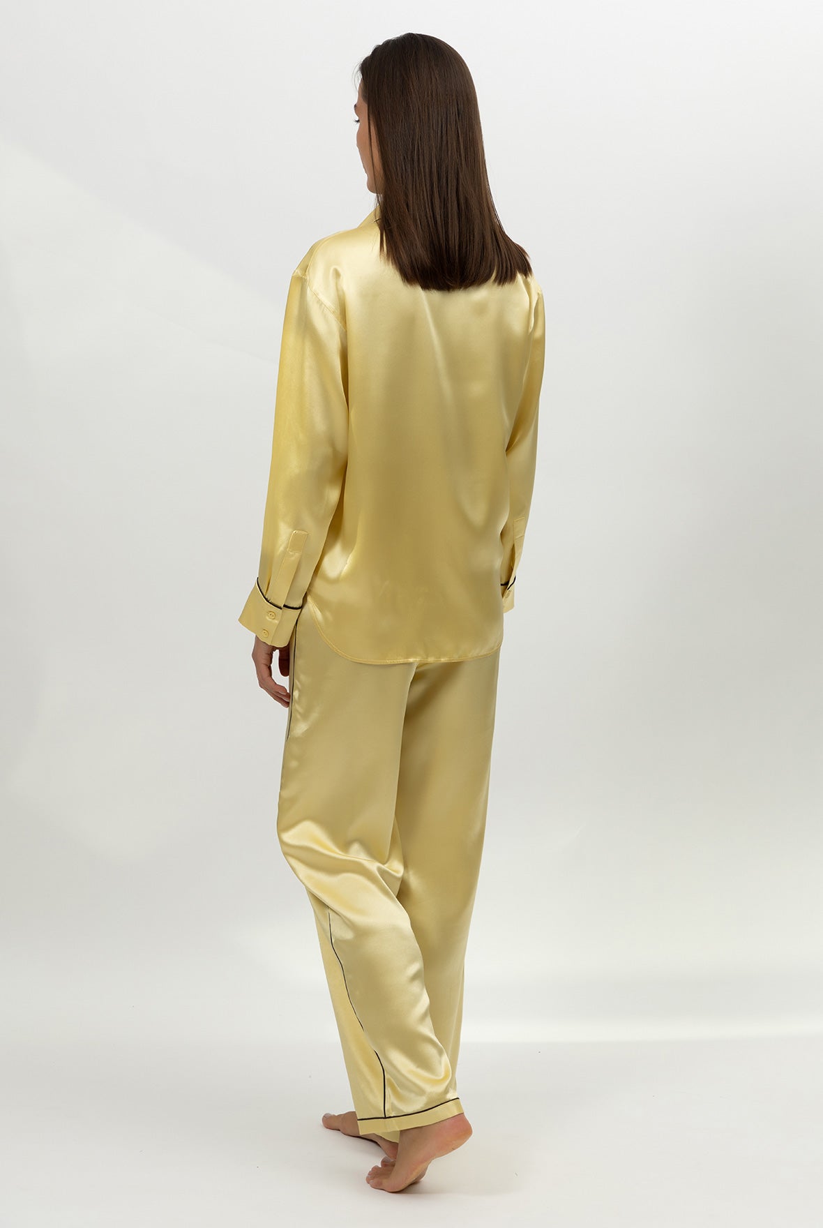 Gold silk satin pyjama set Nokaya on a white background. Back view.
