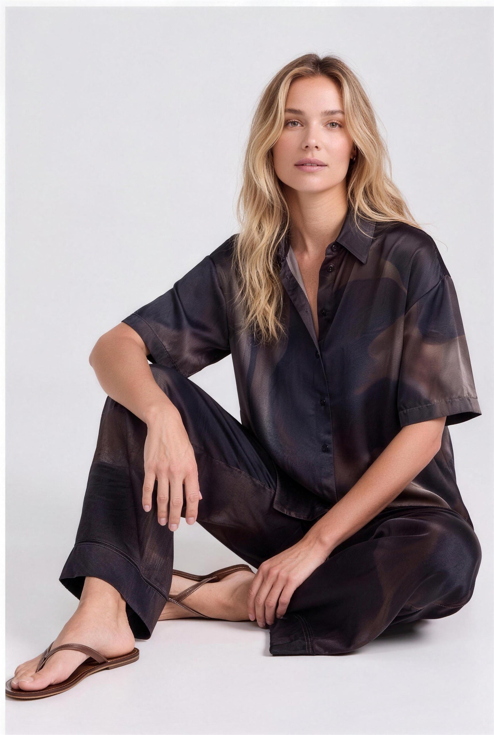 NOKAYA Mirage silk co-ord, seated on floor