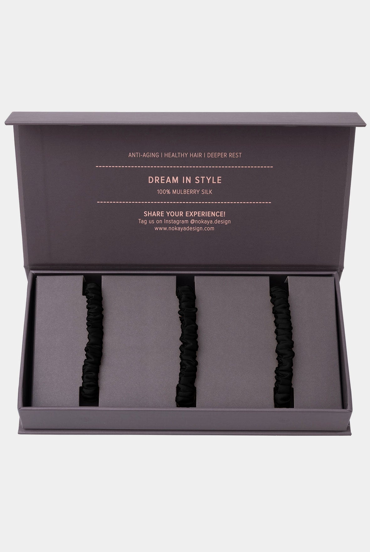 Skinny Silk Scrunchie Set Nokaya in Black inside the gift box.