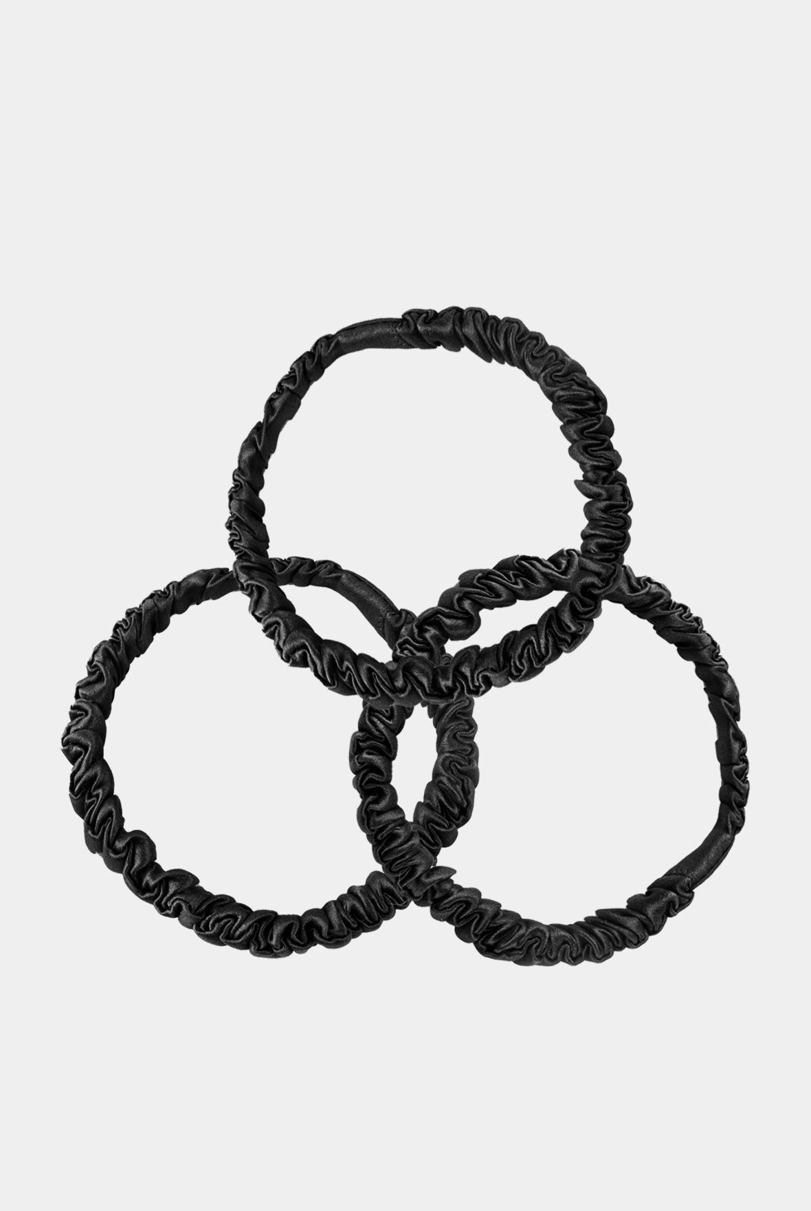 Black silk Skinny Scrunchie Nokaya on white background.