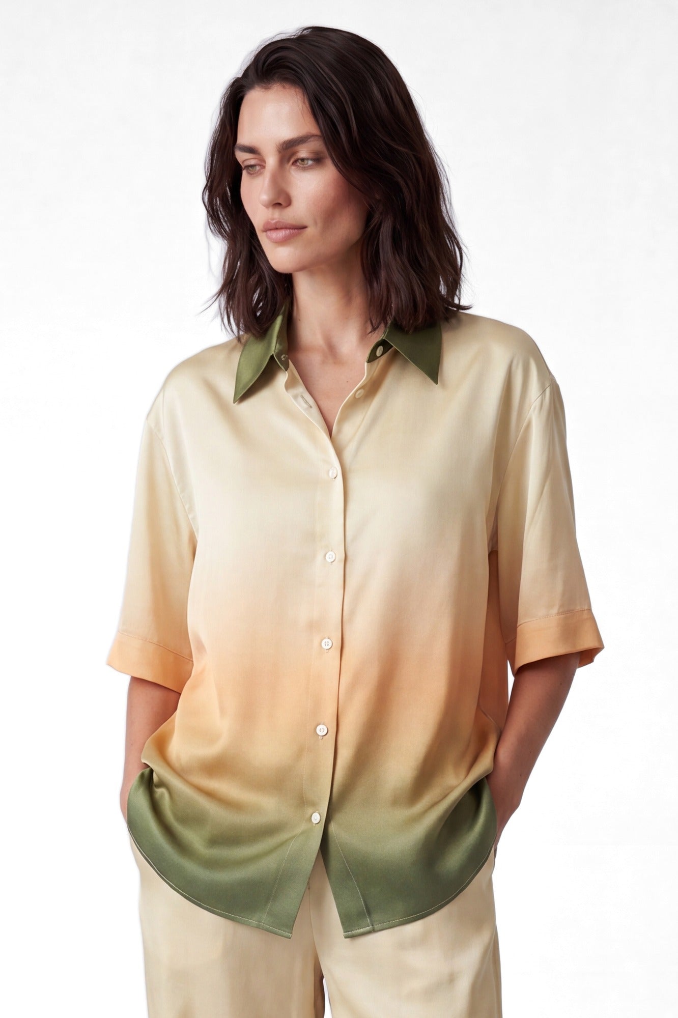 NOKAYA FlowState silk shirt, whole shirt in frame, hands in pockets, side slits