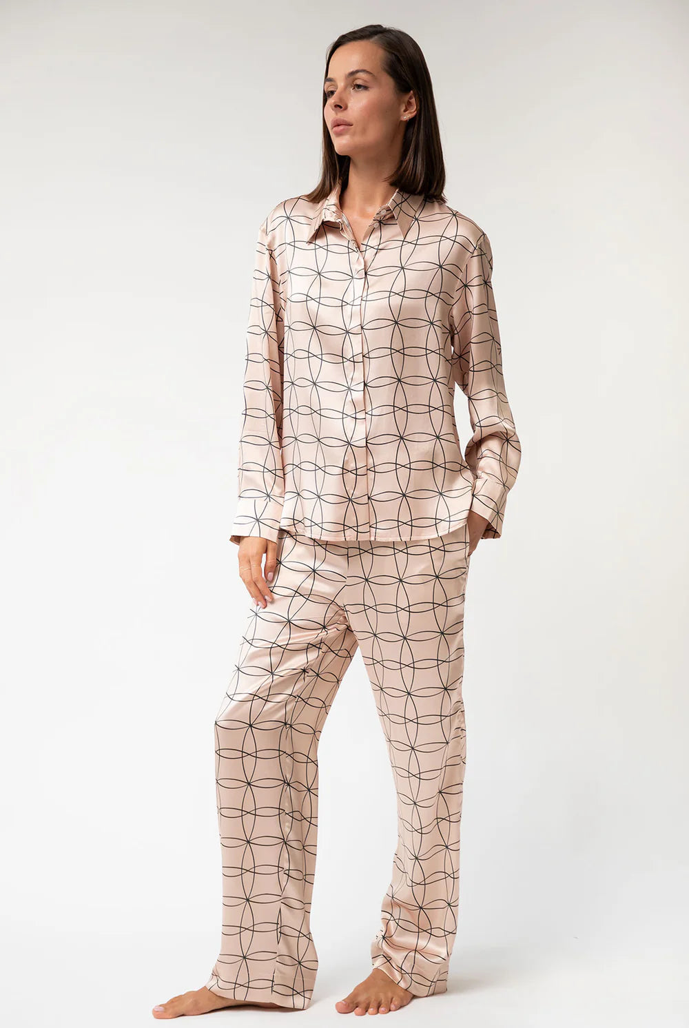 Silk pink-patterned pyjama set Nokaya on a white background