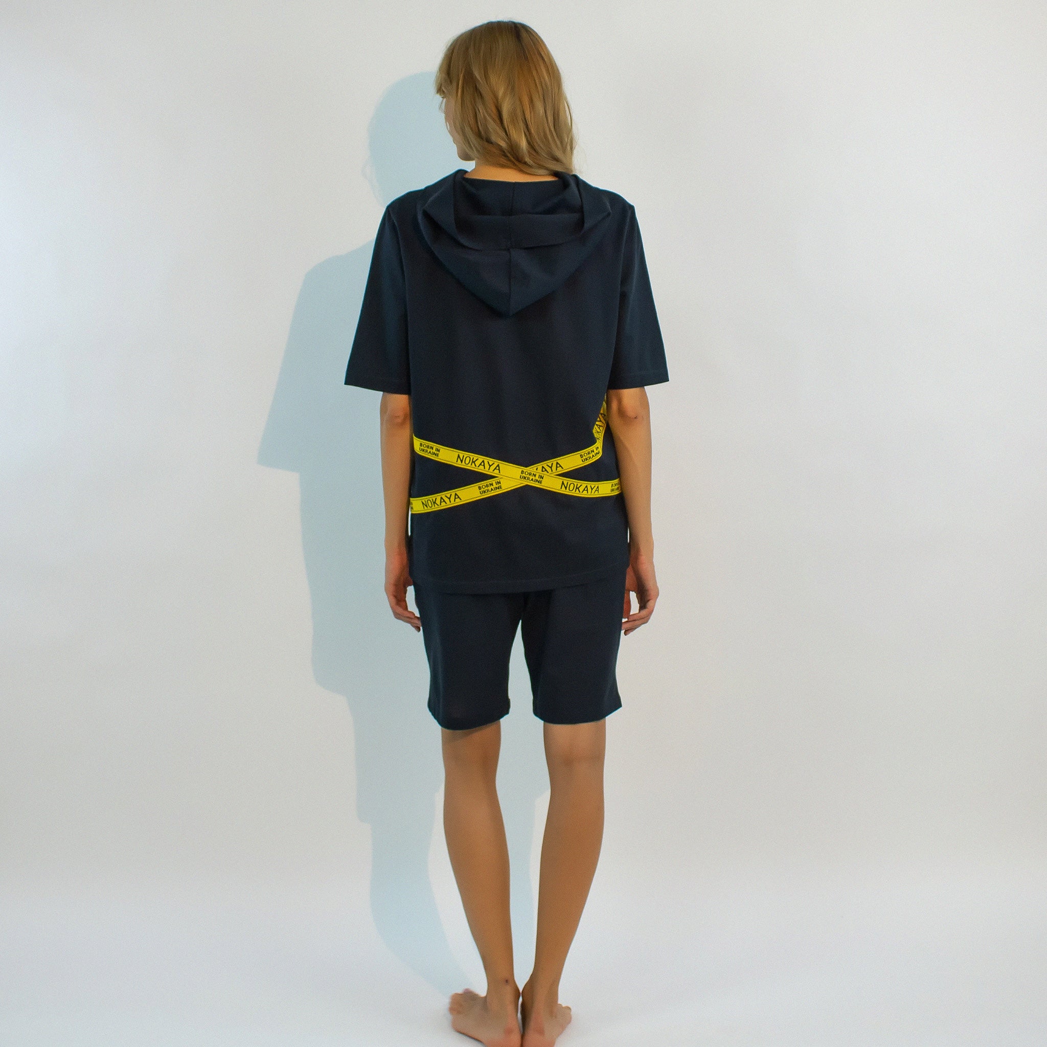 The almost black textured cotton shorts in a relaxing silhouette with the emphasis on yellow stripes with a logo.