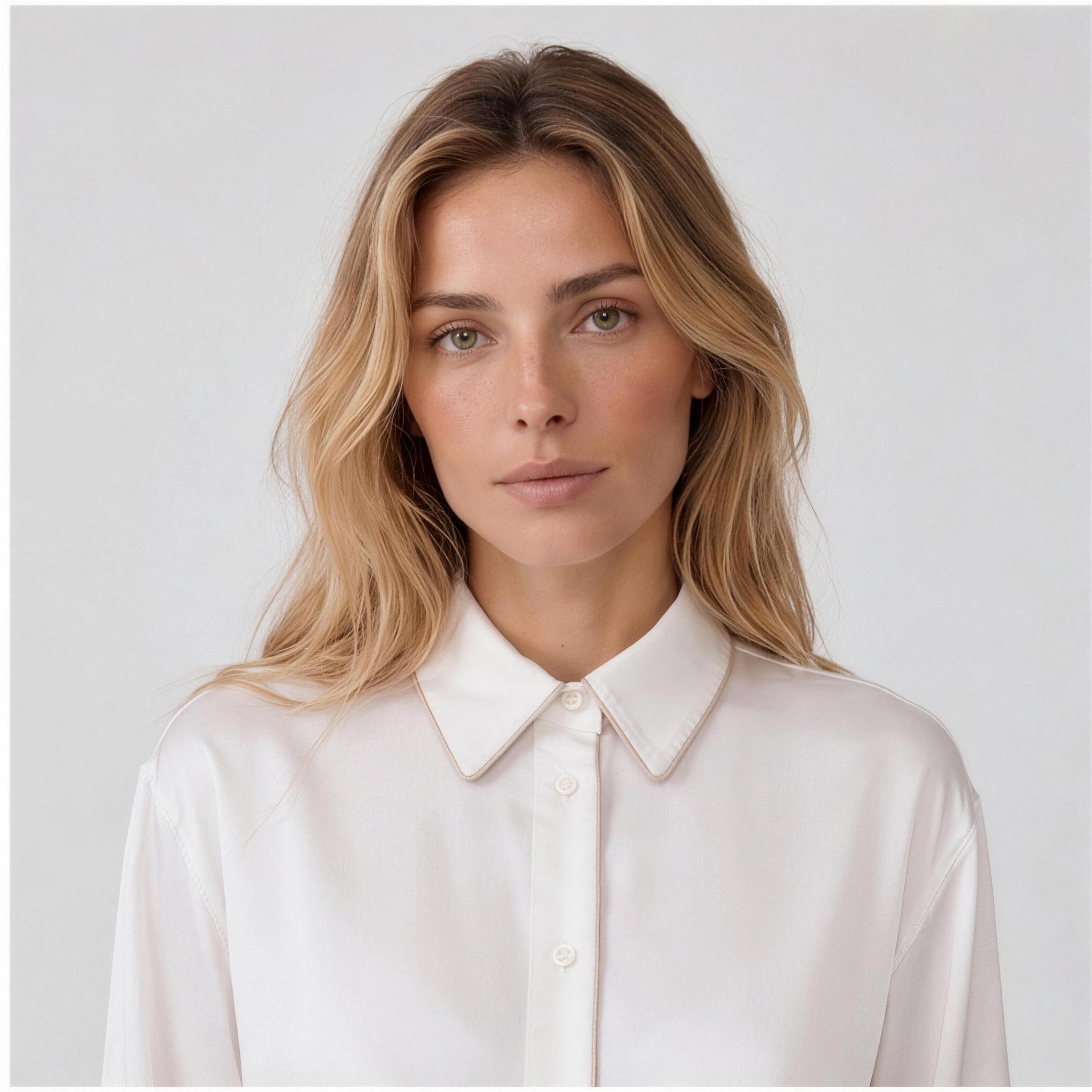 Ivory silk shirt collar detail with mother-of-pearl buttons and caramel piping, NOKAYA