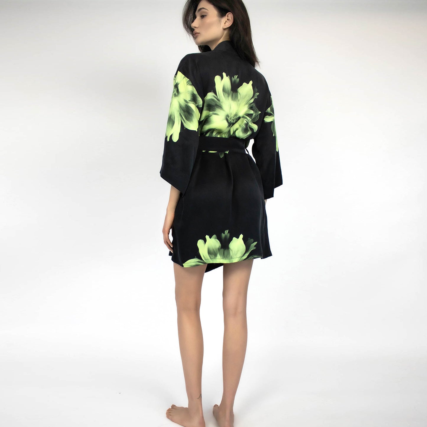 Designer flower print on black ground on the back of women's silk robe