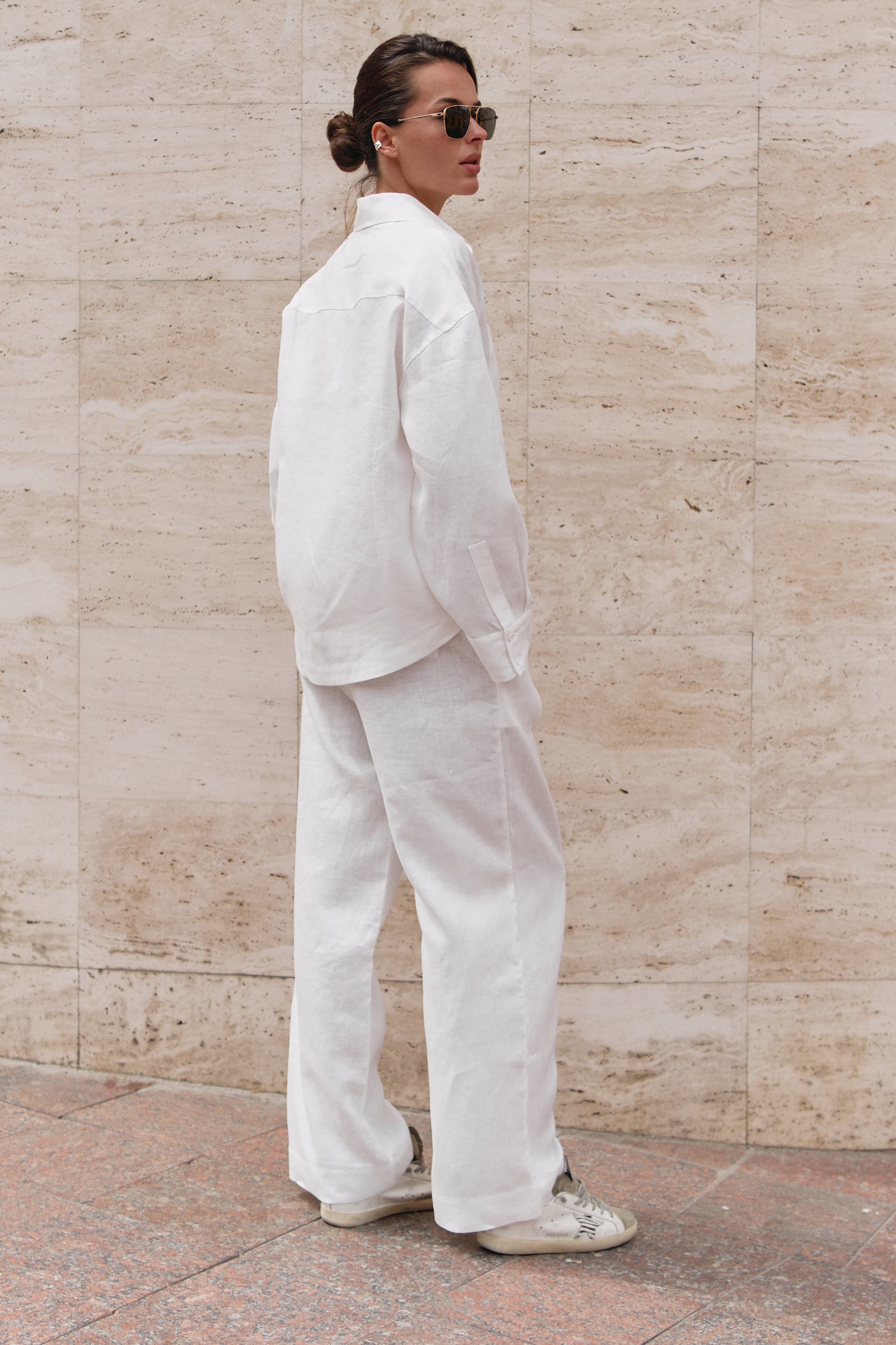 Lien trousers in white  with long sleeve shirt Nokaya. Back view.