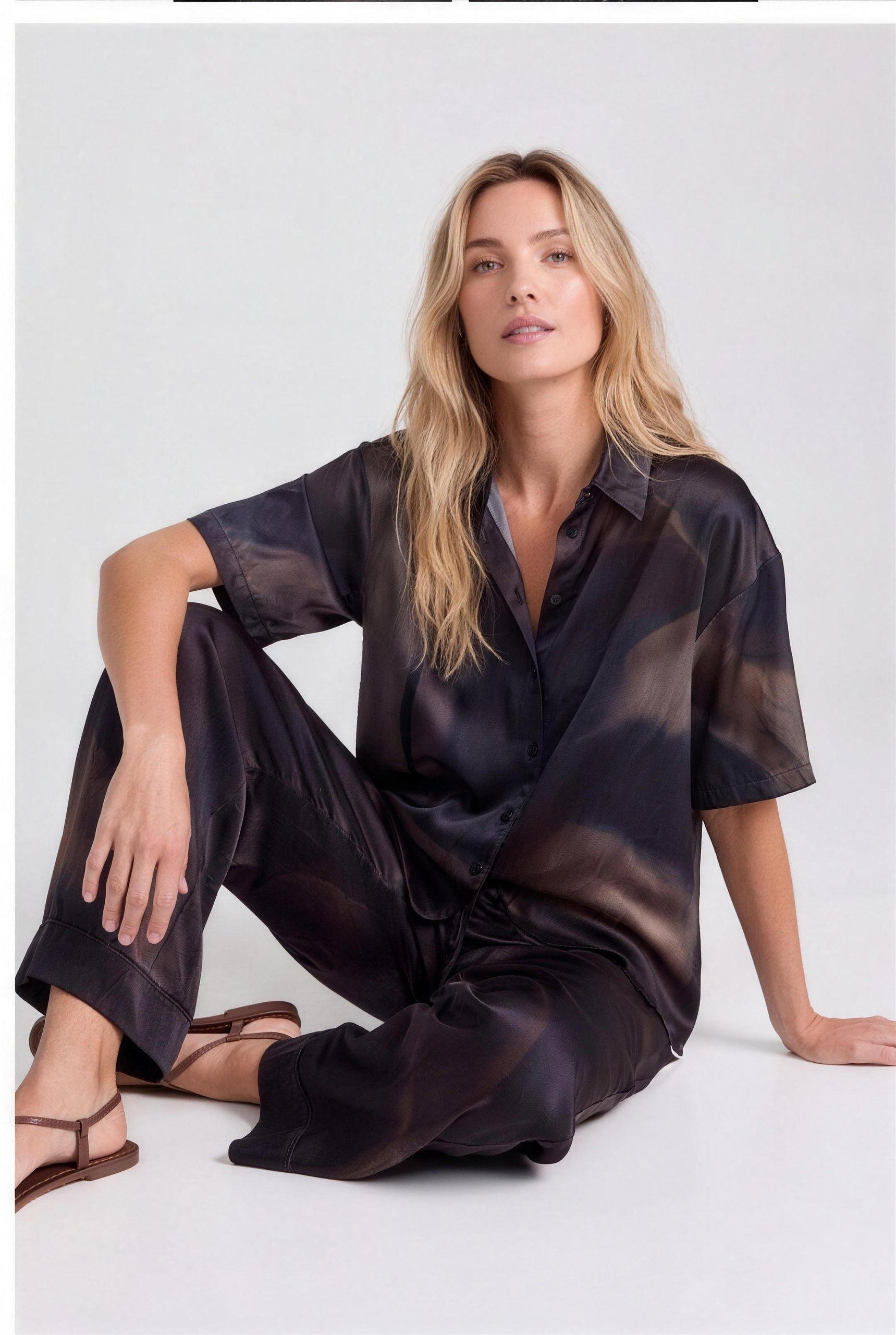 NOKAYA Mirage silk co-ord, seated on floor, editorial