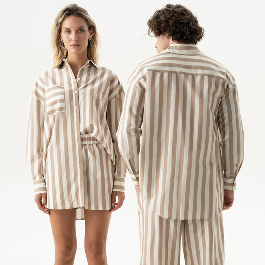 Two people wearing matching striped cotton silk sets Nokaya, on a white background