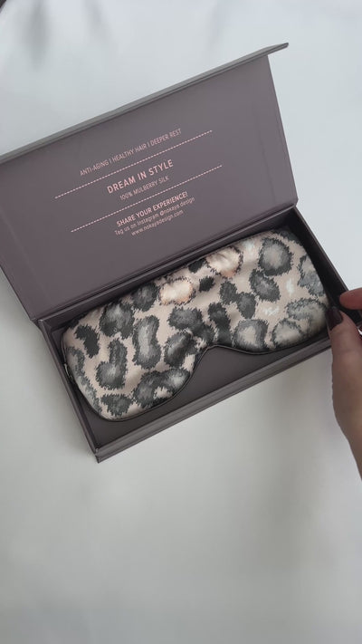 silk eye mask with animal print colour. On the video lady open gift box with eye mask Nokaya