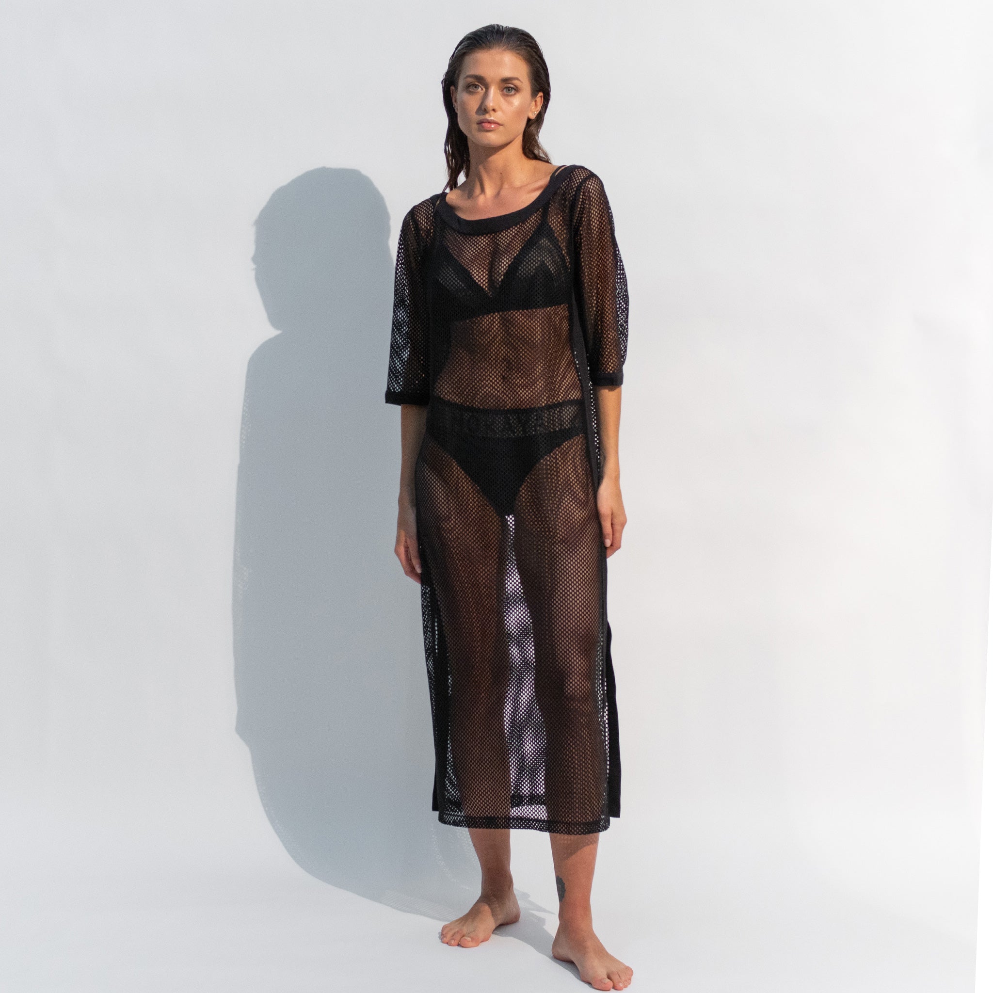 Stylish Daring Net black dress is perfect for layering over a swimsuit.