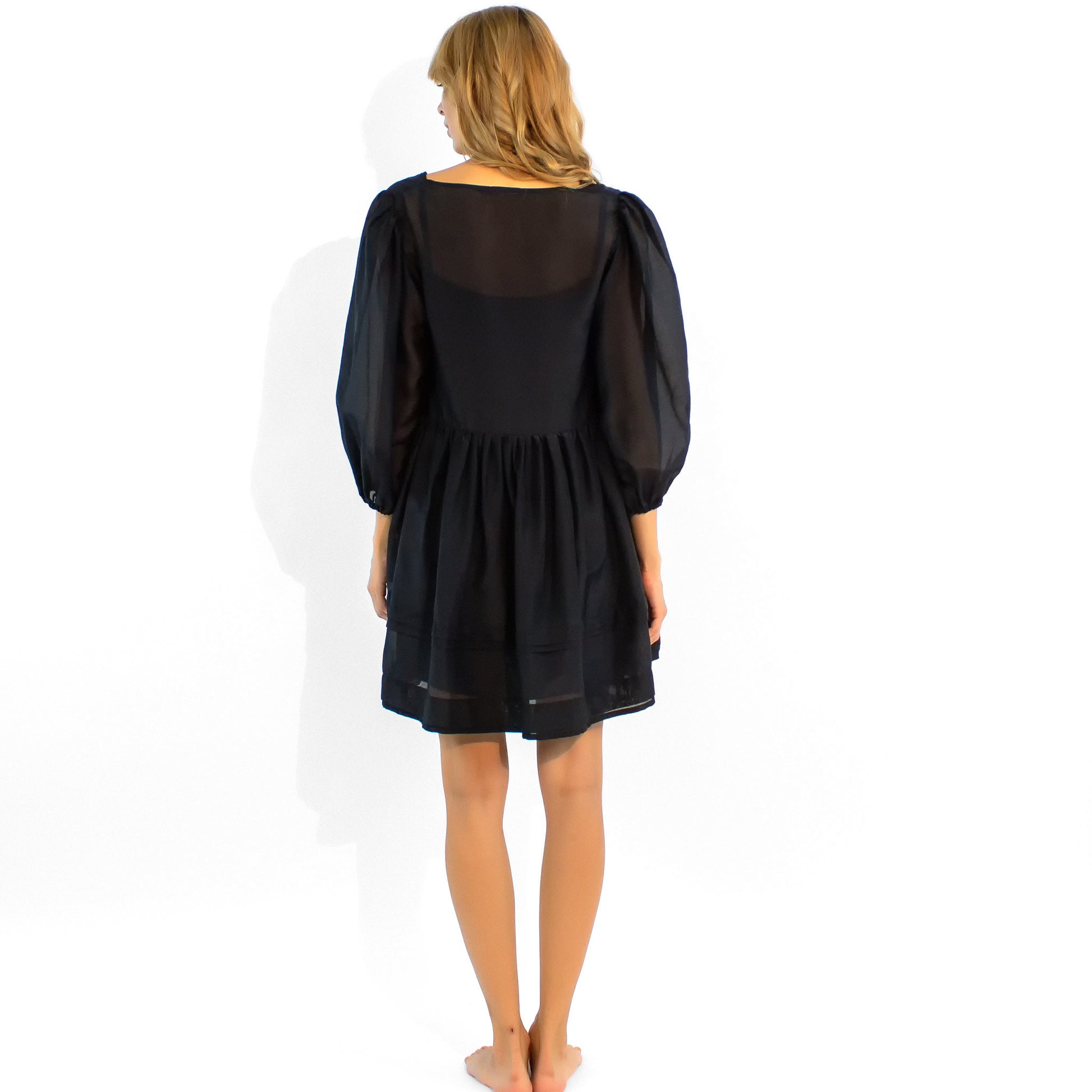 The NOKAYA black Mini dress made of the cotton-silk veil.