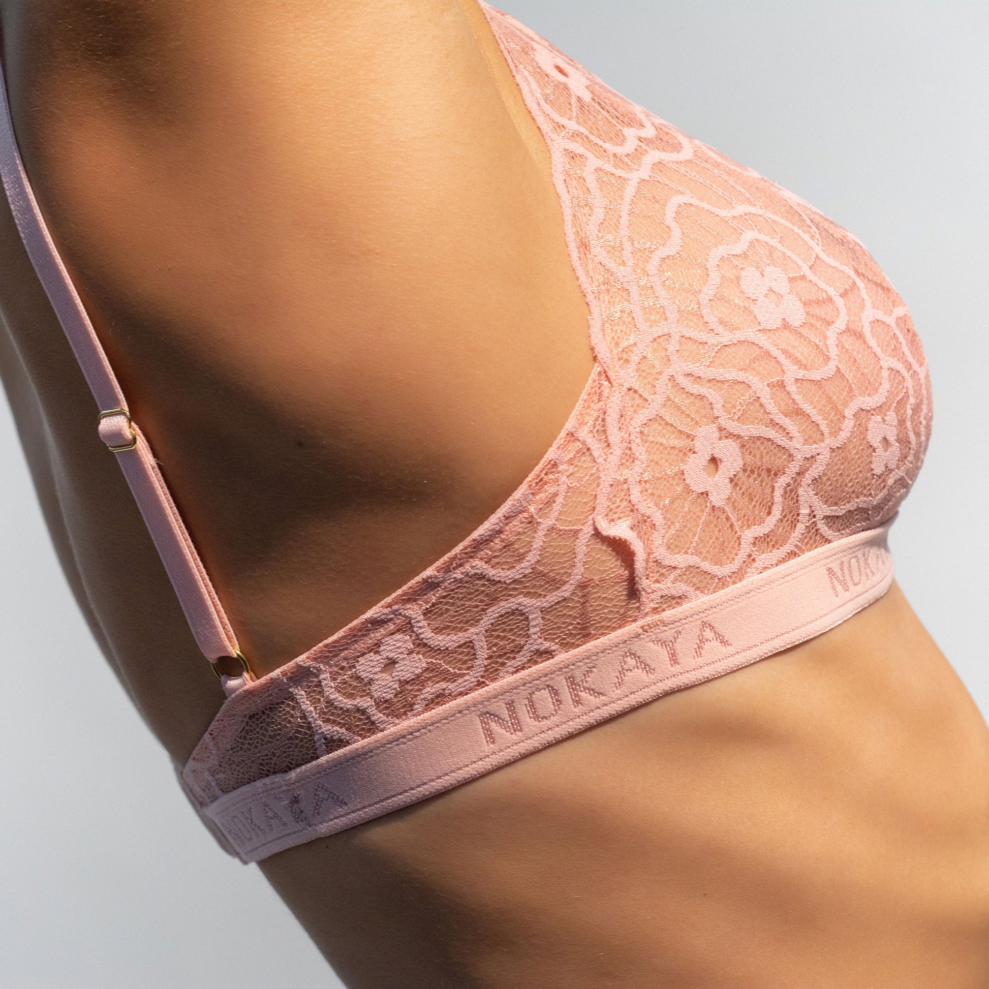 Nokaya modern pink lace image bralette with the elastic logo tape.
