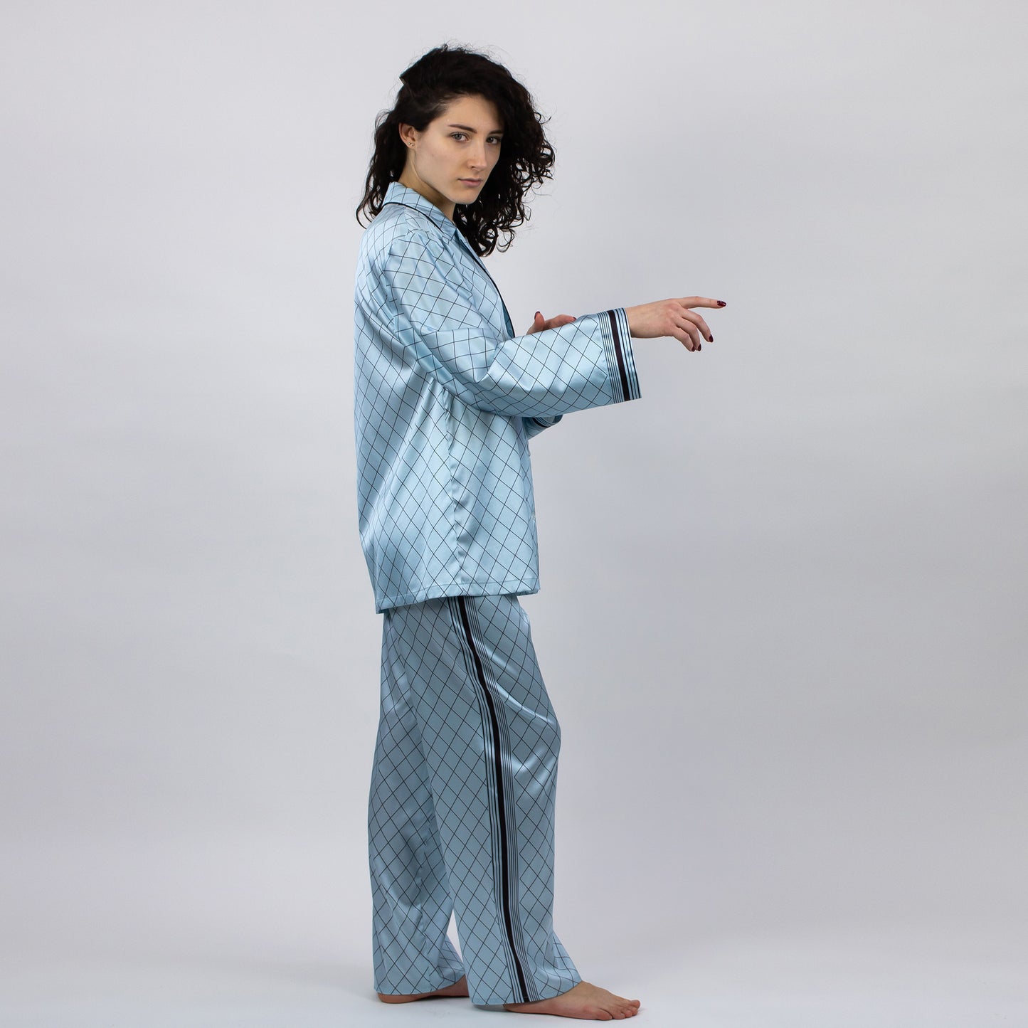 The Lady shirt from NOKAYA is crafted from Mulberry silk and features a relaxed straight cut.