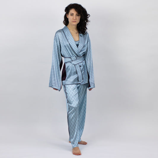 The Lady kimono is a cut from Mulberry silk fabric in a sky-blue hue with a subtle graphic print.