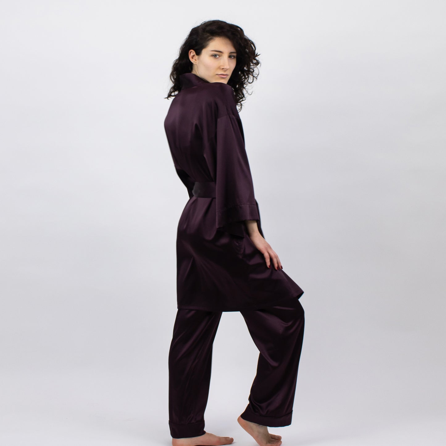 The Lady fudge robe features a relaxed straight cut, wrap style front, a belted waist, a short length and a comfortable fit.